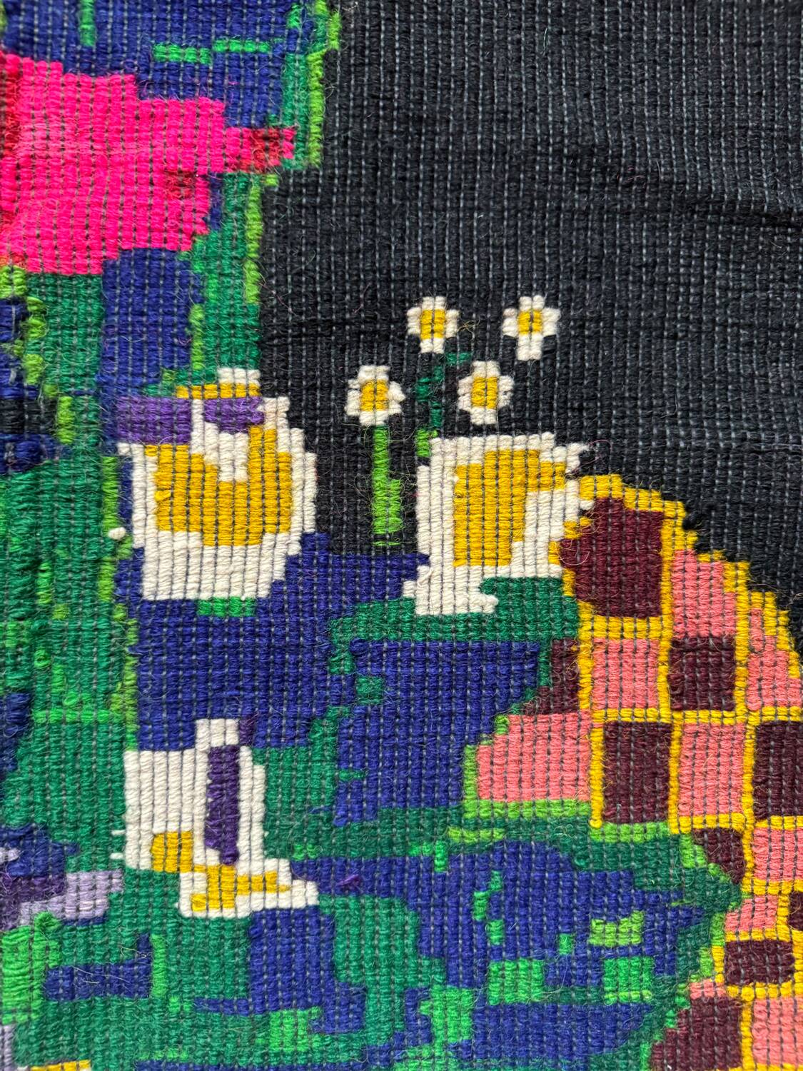 Romanian black wool carpet with a basket of colorful flowers