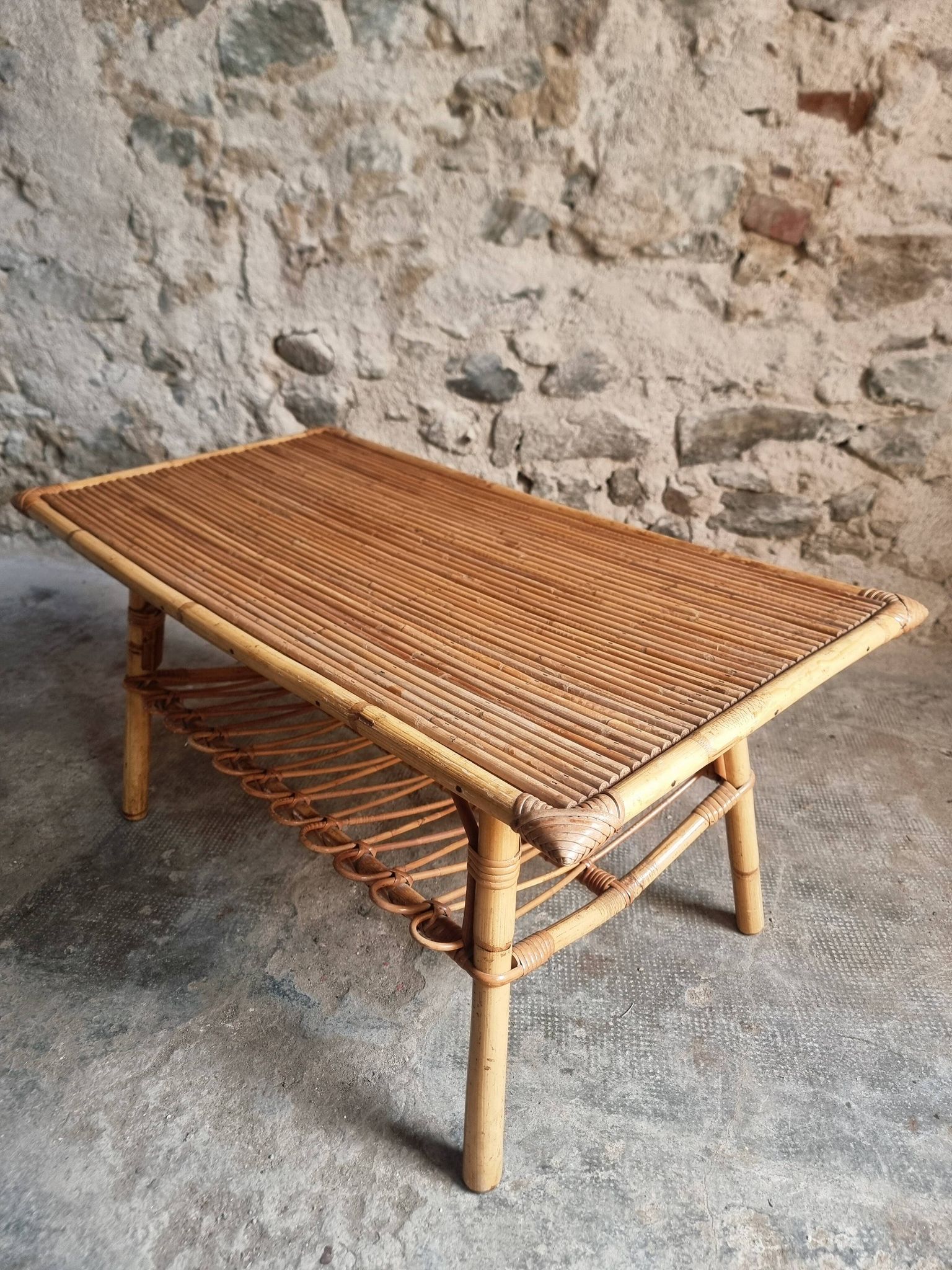 Vintage bamboo and rattan coffee table with magazine rack, French, circa 1960–1970.