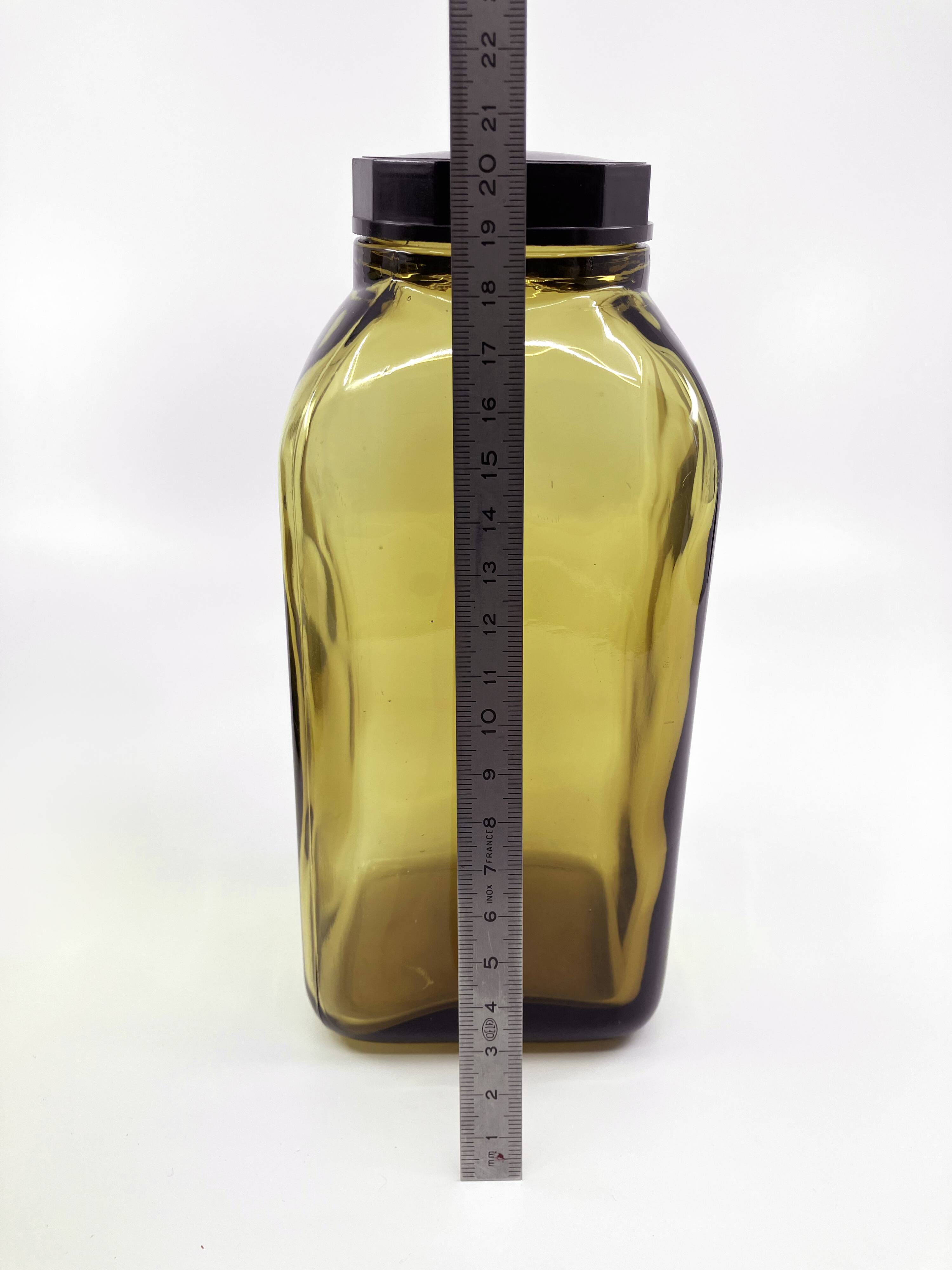 3 molded amber glass pharmacy bottles • Bakelite stoppers • 1950