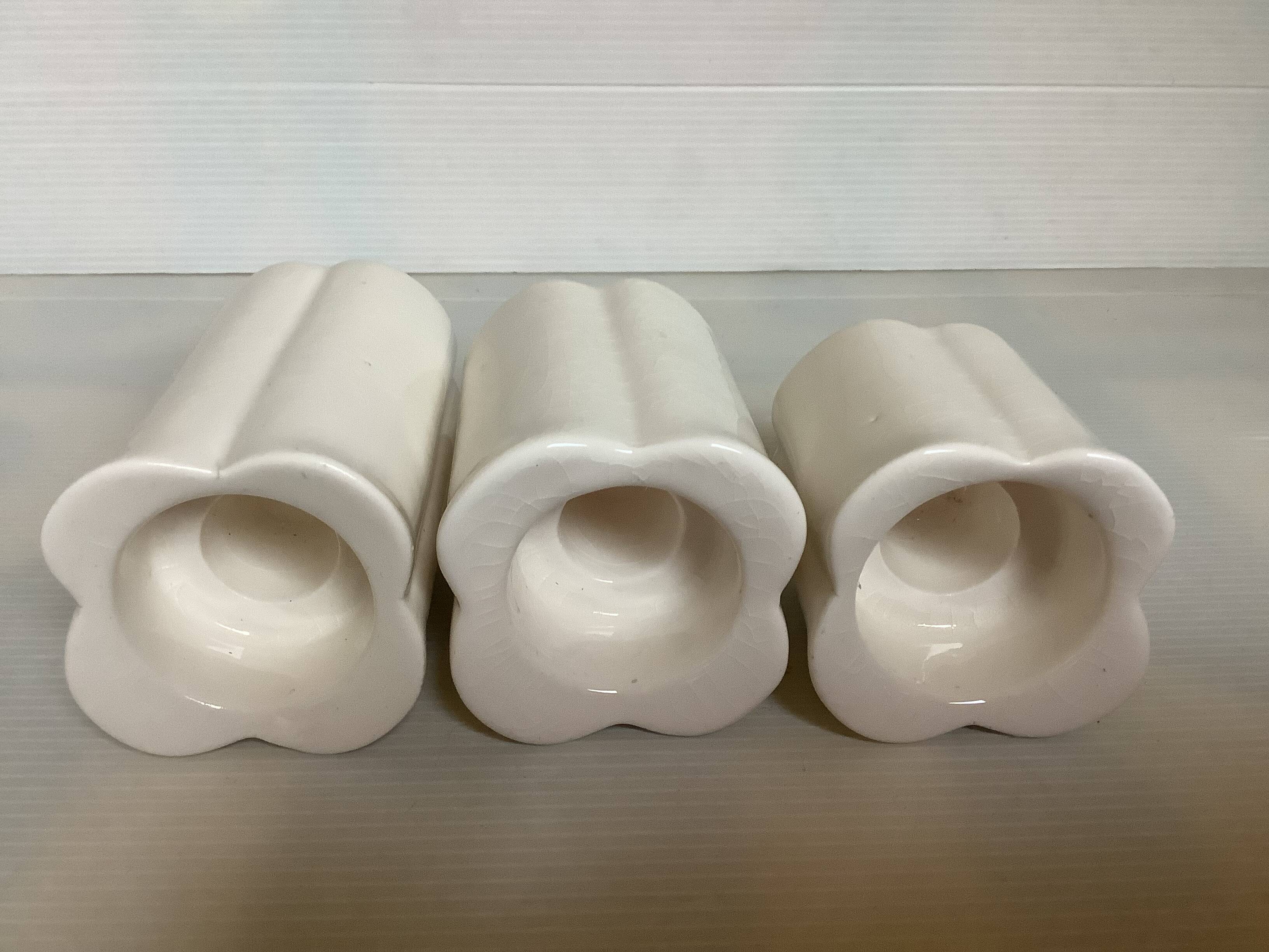 Trio of four-leaf clover candle holders