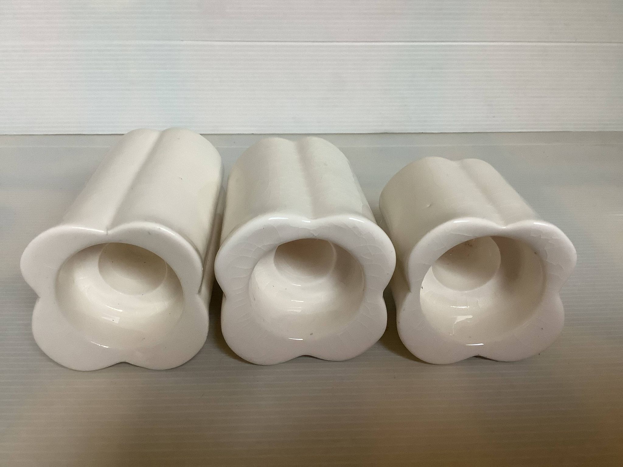 Trio of four-leaf clover candle holders