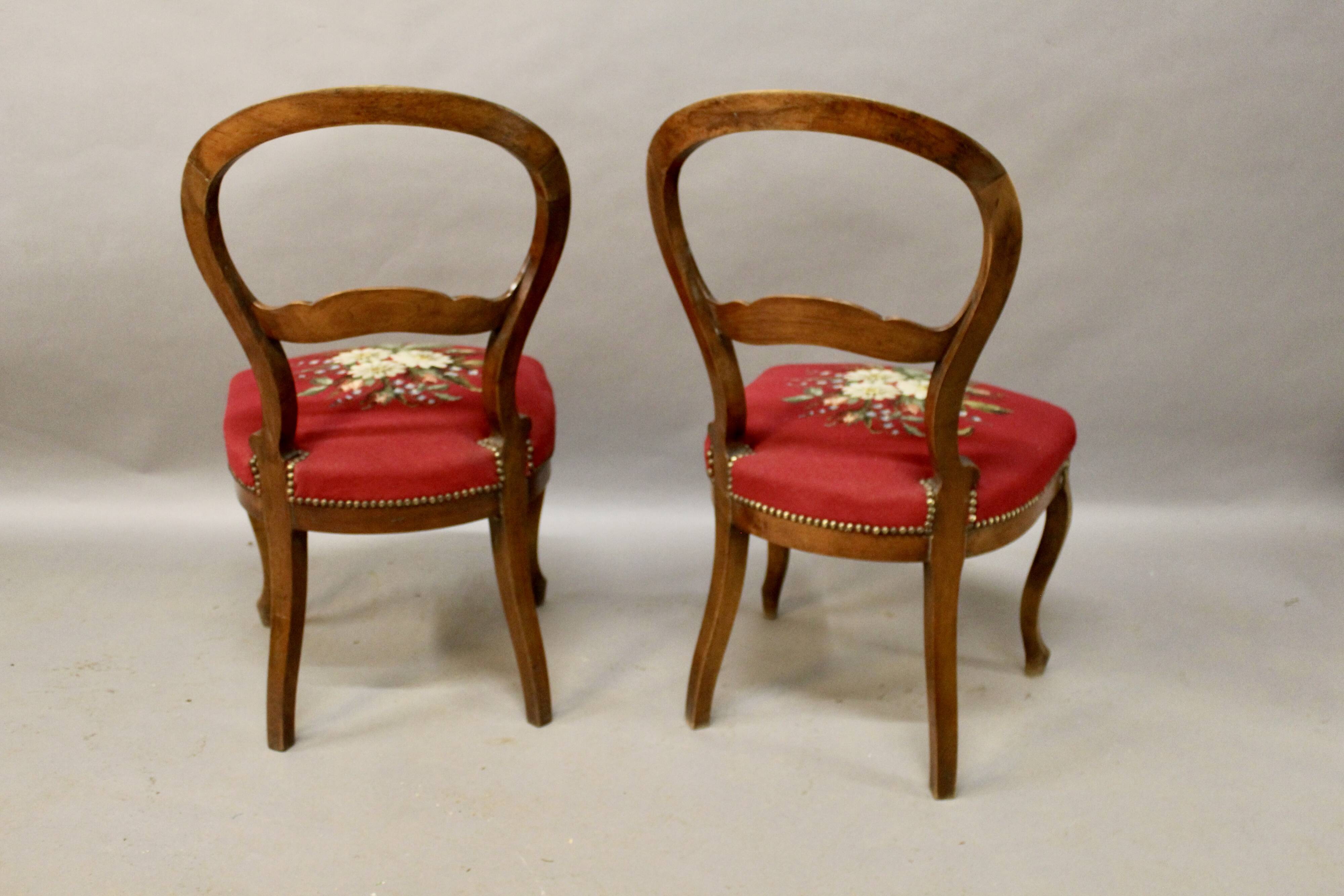 Pair of Louis Philippe walnut chairs, petit point tapestry