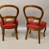 Pair of Louis Philippe walnut chairs, petit point tapestry