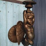 Paire de torchères murales putti en fonte