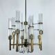 Lustre à huit bras en laiton et tube de verre. Italie des années 1960, Sciolari