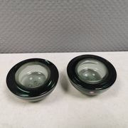 A set of iitalla candle holders in smoked transparent glass.