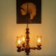 Suspension with three lights, turned varnished wood, amber tulip shade, 1970s.