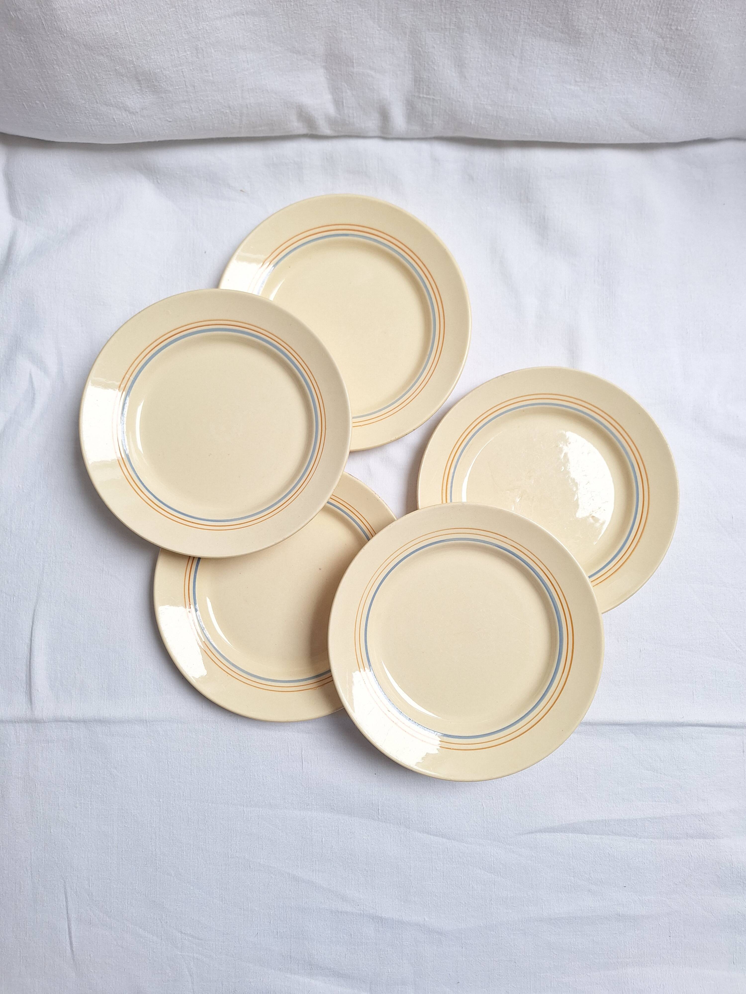 Vintage cream, orange and blue dinner plates.