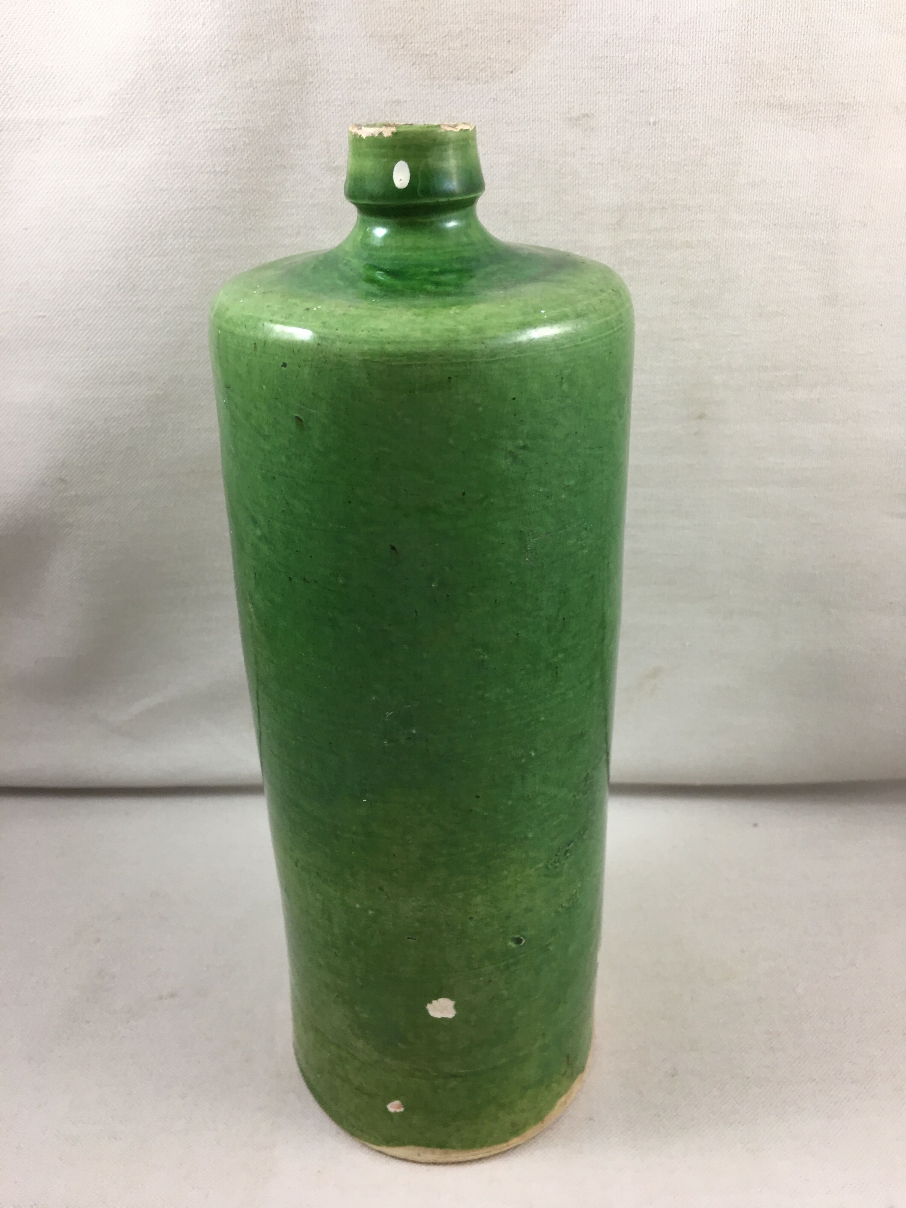 Green glazed terracotta bottle deco