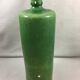 Green glazed terracotta bottle deco