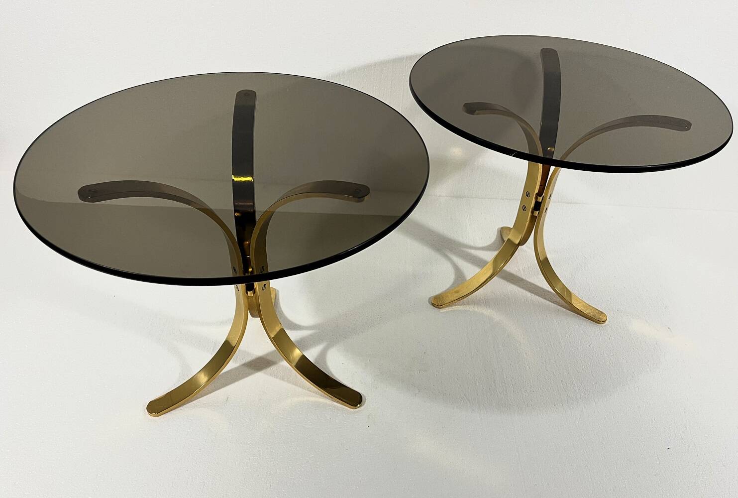 Brass and smoked glass side tables from the 1960s.
