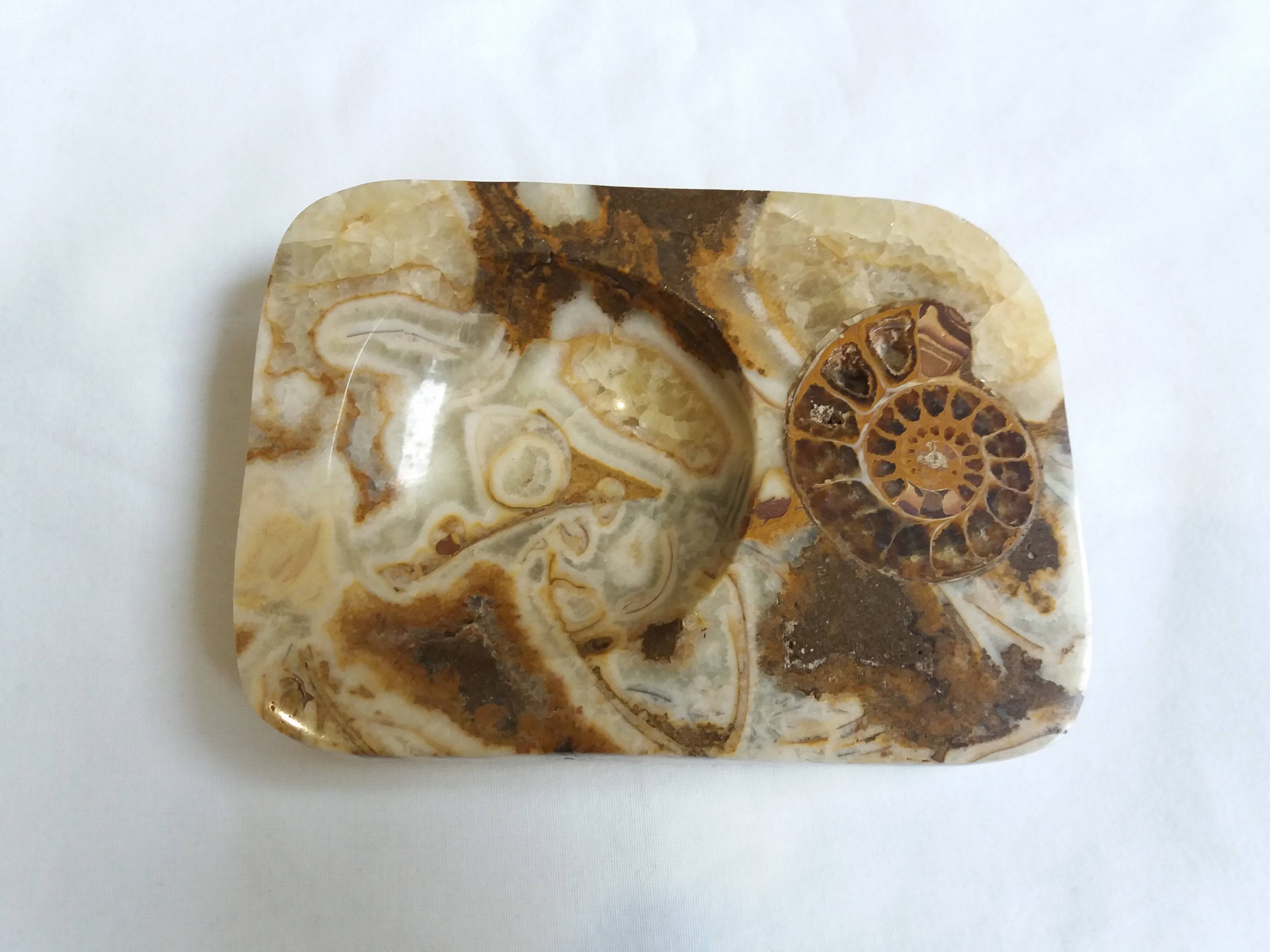 Marble pocket ashtray with fossil ammonite