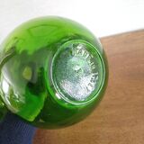3 green glass bottles