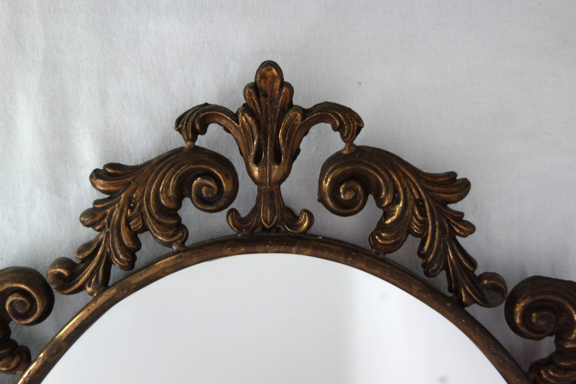 Antique oval art deco brass mirror