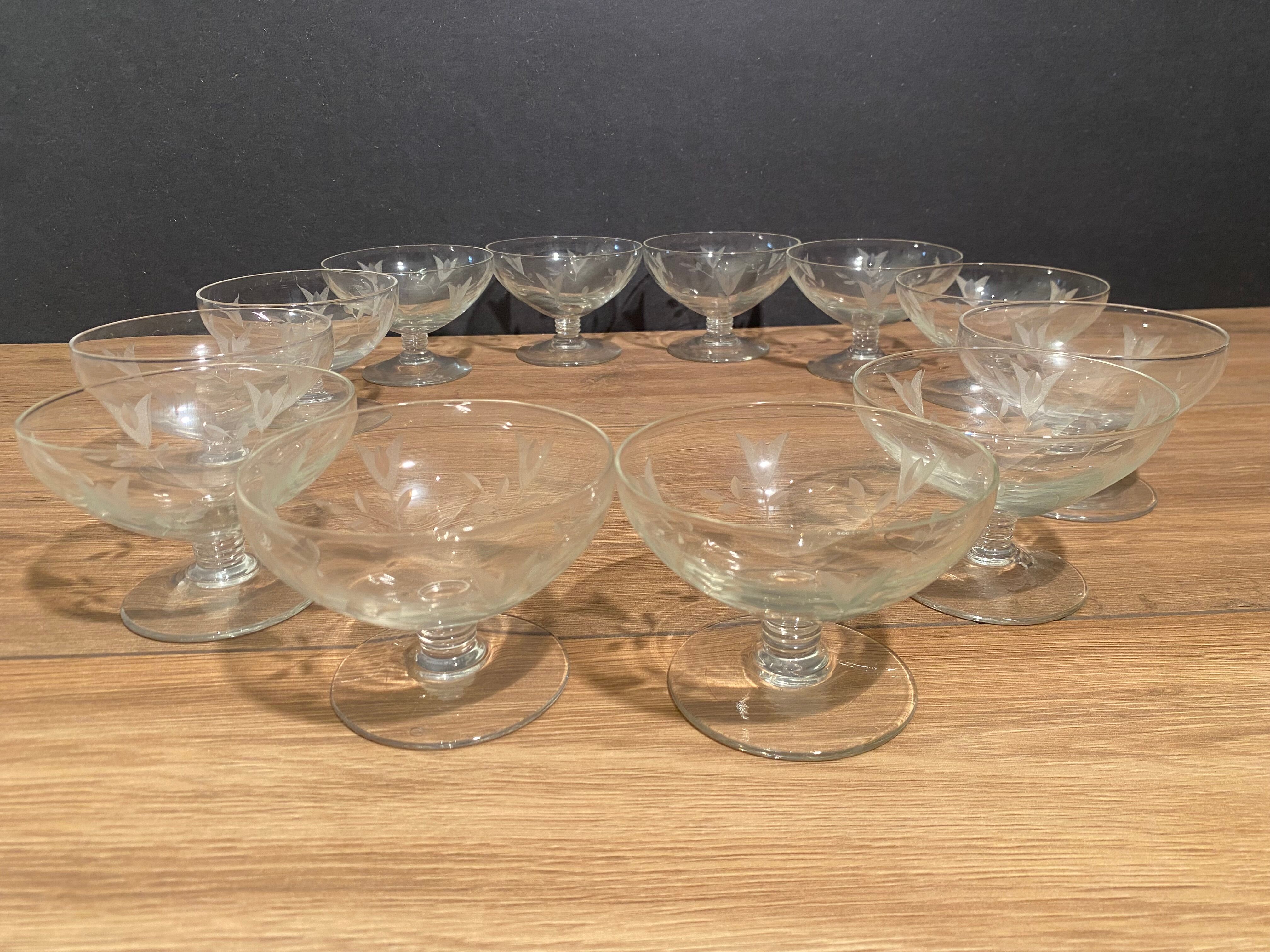 Suite of 12 champagne glasses in cut glass with floral decoration