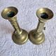 Pair of antique brass candlesticks with adjustable push mechanism from the 19th century.