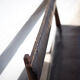 Antique wood bench and black imitation leather