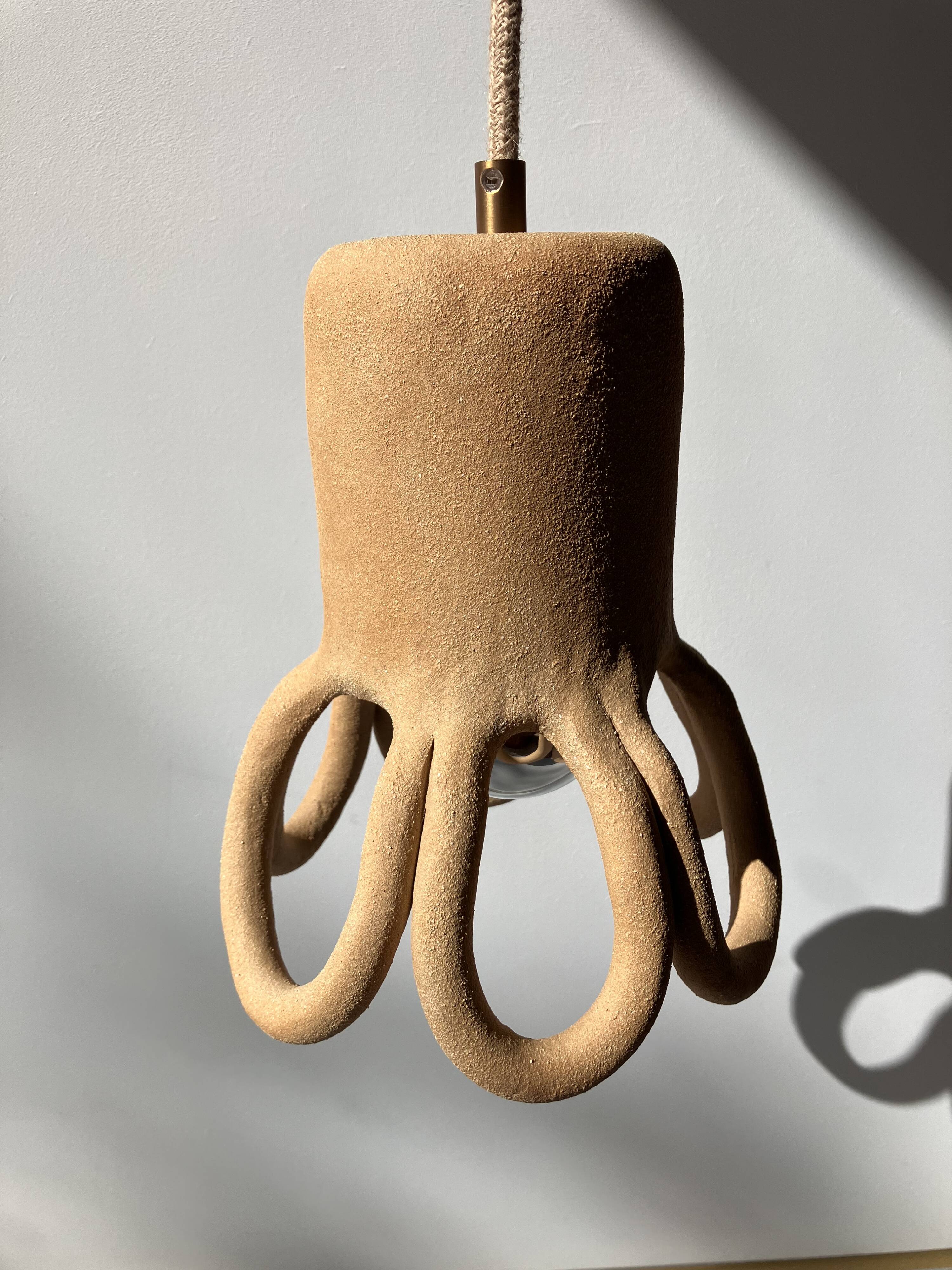 Suspension in the shape of a flower made of handcrafted ceramic, raw red stoneware mid-century.