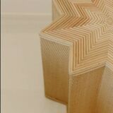 Small star-shaped side table in cream-colored rattan