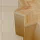 Small star-shaped side table in cream-colored rattan