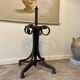 Umbrella holder in arched and dark wood