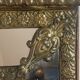 Mirror with brass repoussé frame