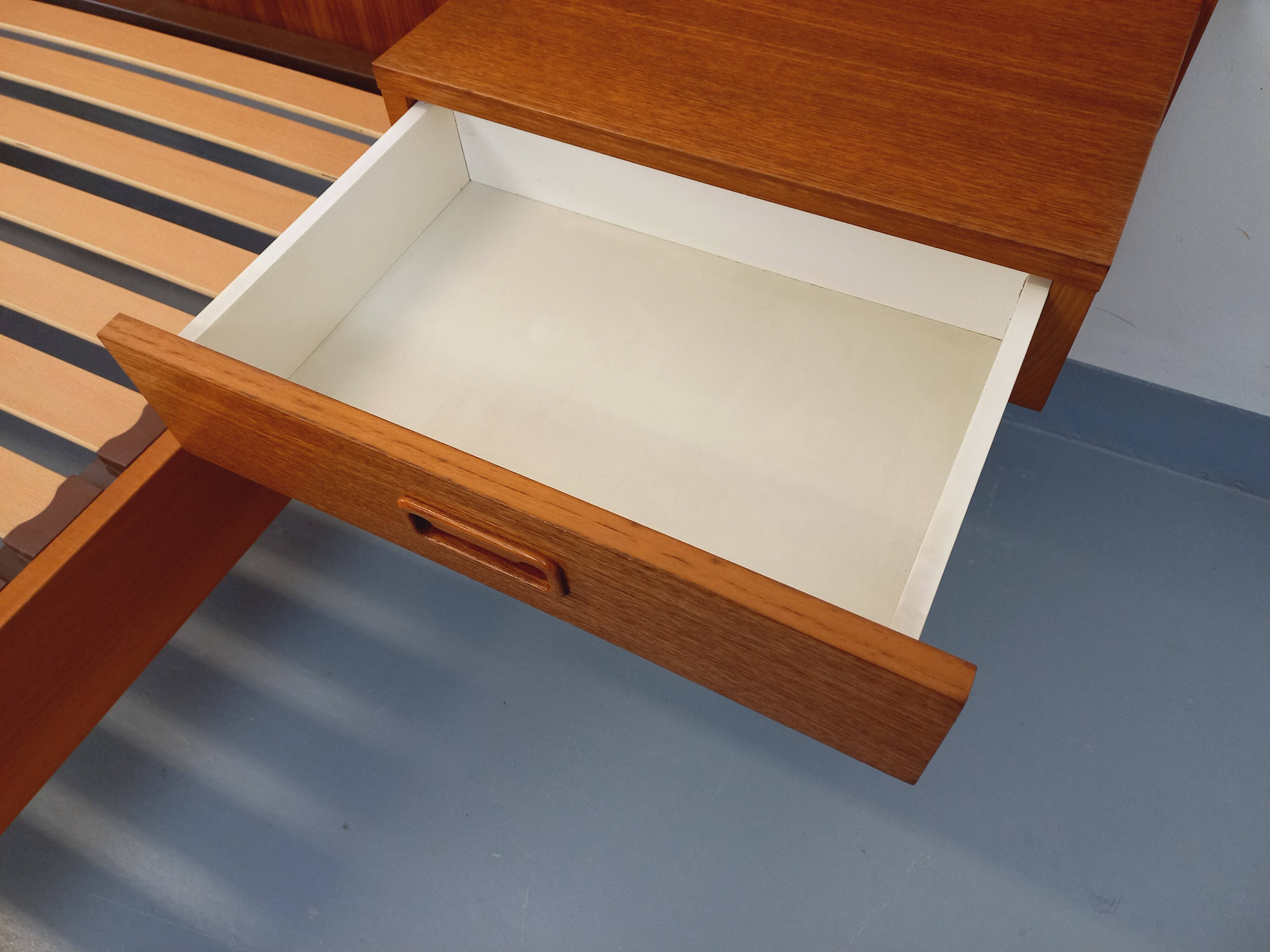 Double bed vintage Scandinavian in teak from the 1960s with integrated bedside tables.