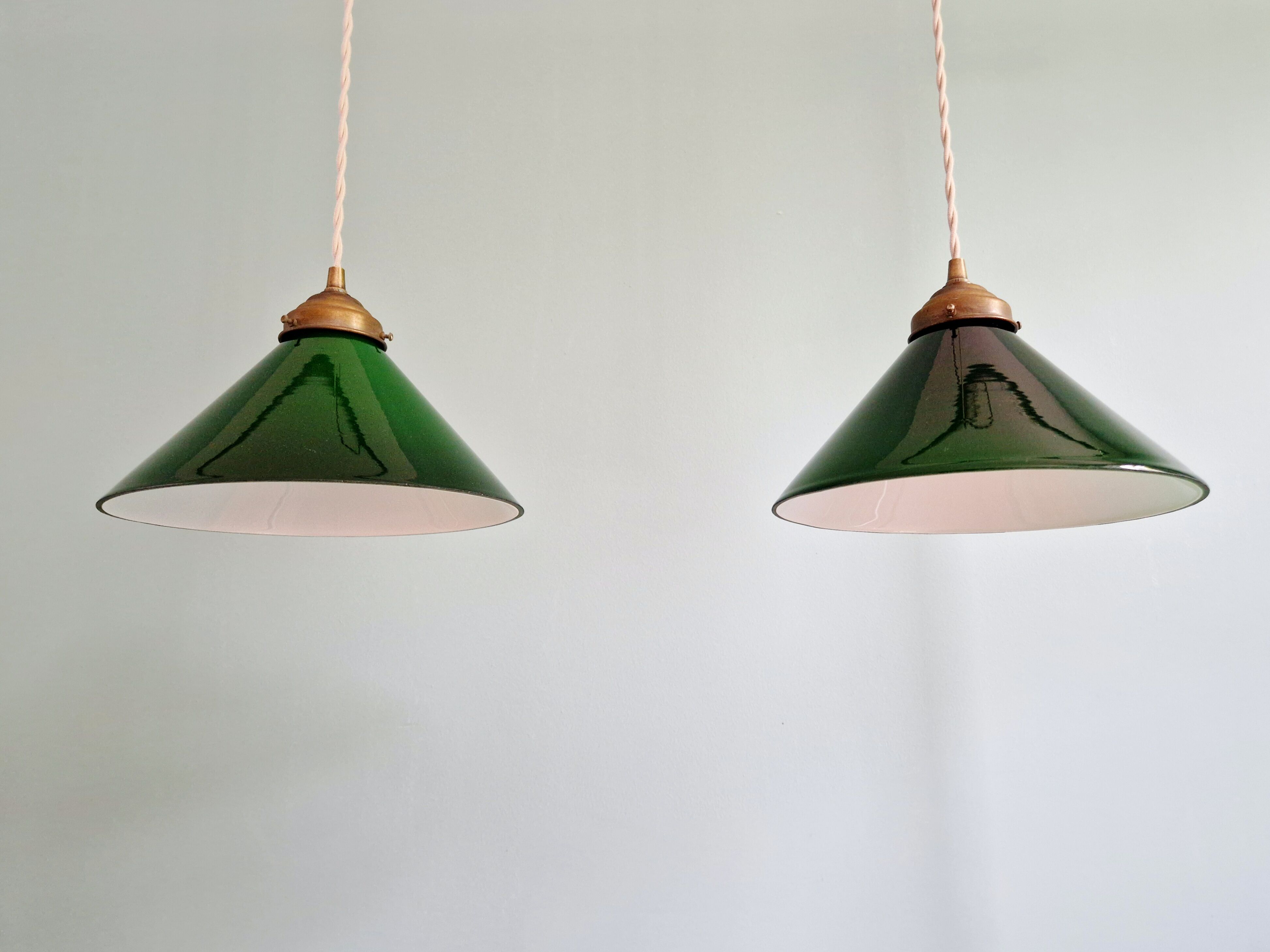 Pair of conical green opaline pendant lights, Art Deco style