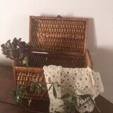 Bagged suitcase in braided wicker and wood