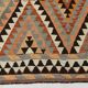 Grand kilim vintage motifs géométriques, tons terre et bleu pastel