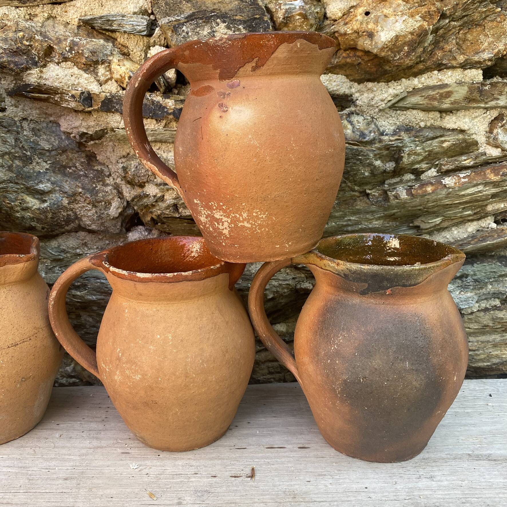set of terracotta jugs country style