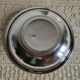 Shallow round metal plate with pearl row decoration.