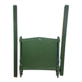 Directoire style bed in painted green wood.