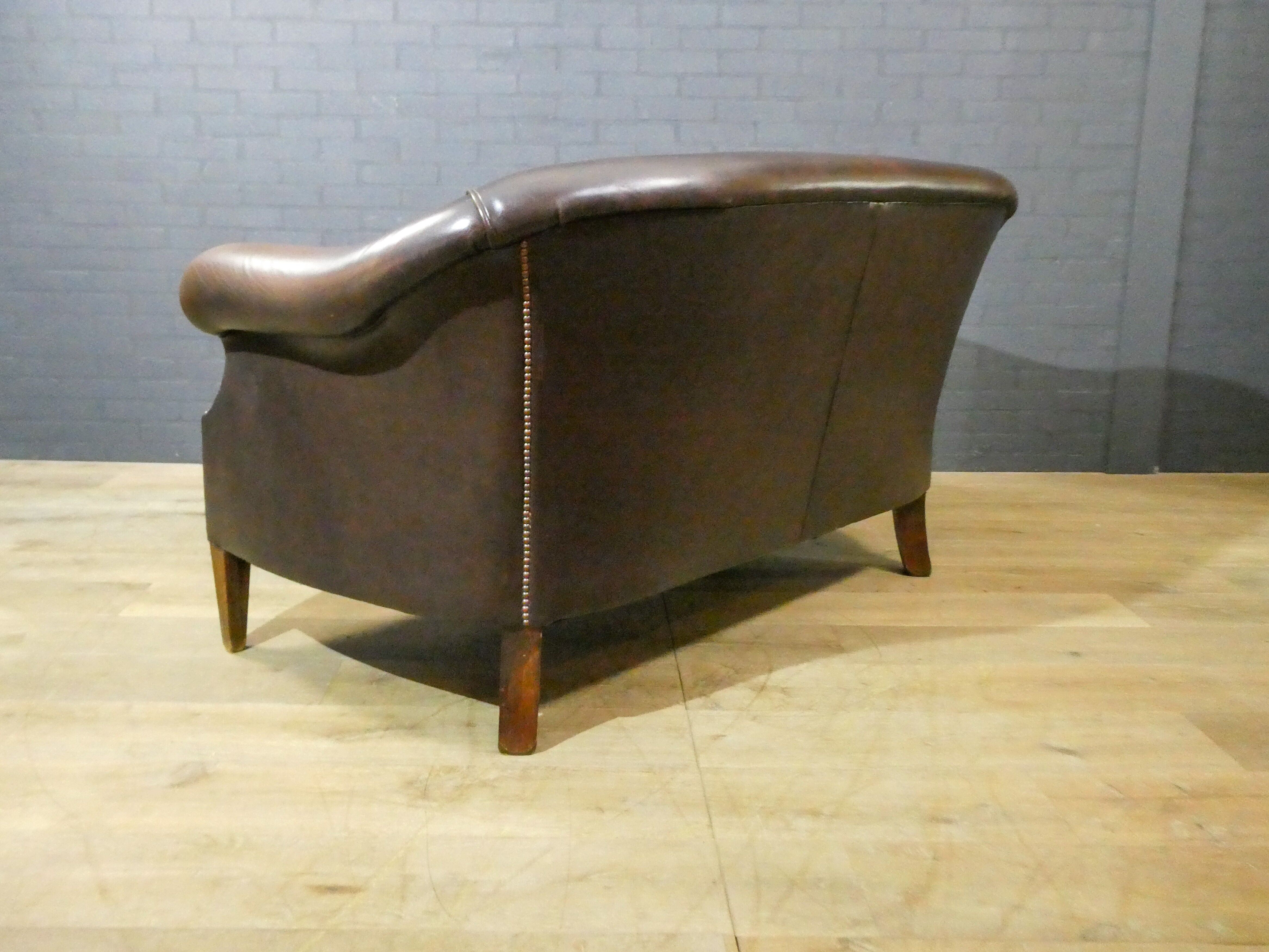 Vintage leather 2-seater sofa in dark brown