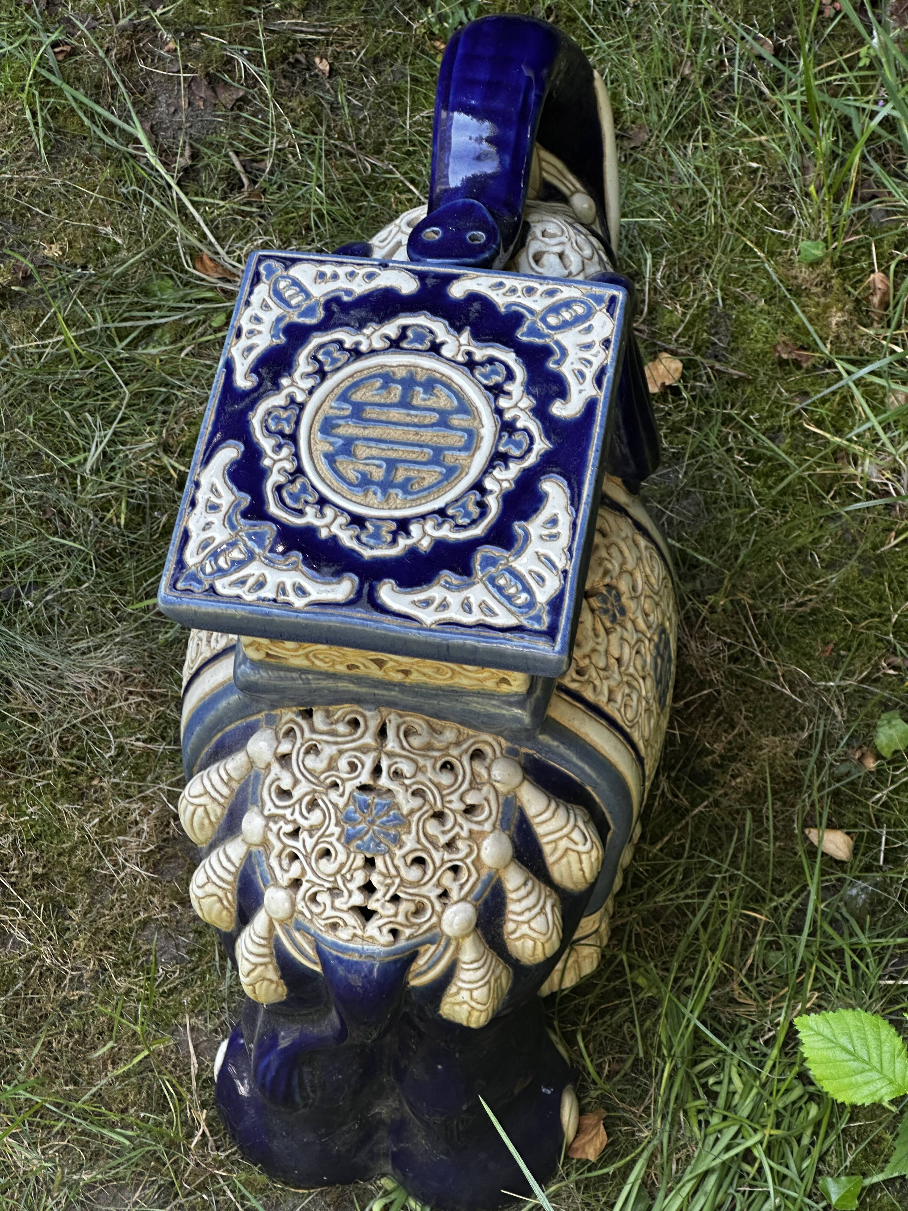 Elephant stool in glazed ceramic in cobalt blue and ivory colors