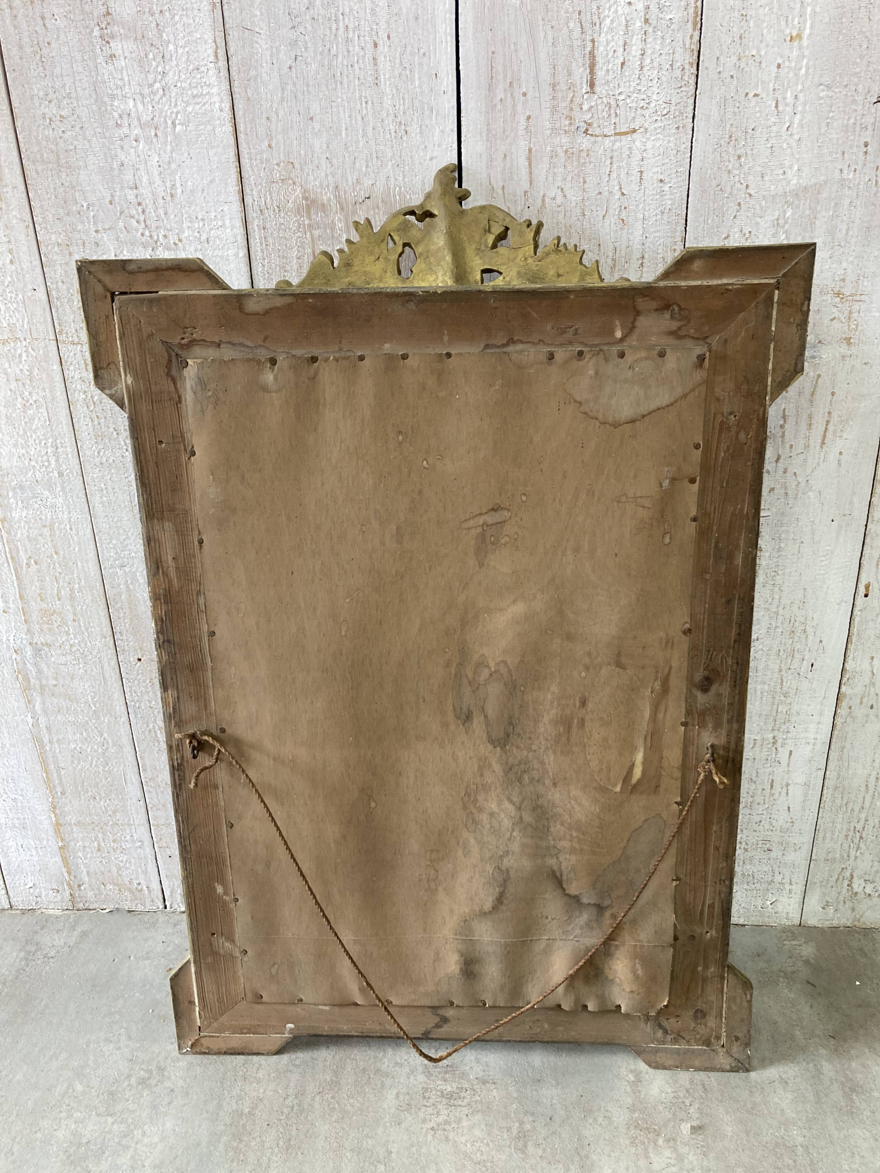 Antique mirror with a pediment