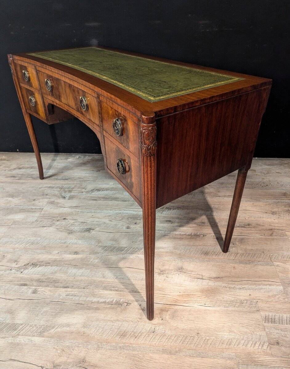 Art Deco desk in curved mahogany veneer.