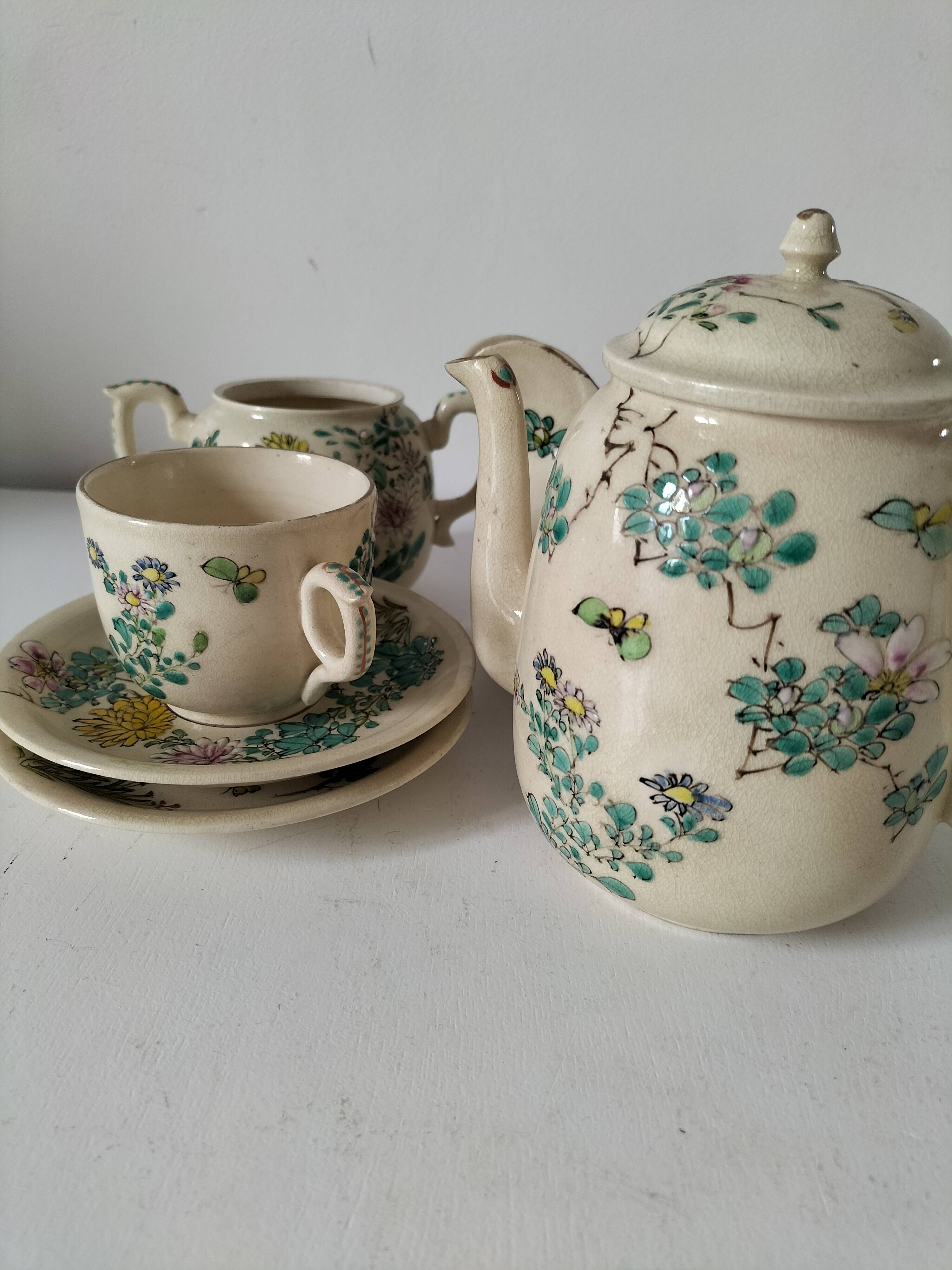 Japanese-style tea set in cracked earthenware with chrysanthemum flowers
