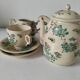 Japanese-style tea set in cracked earthenware with chrysanthemum flowers