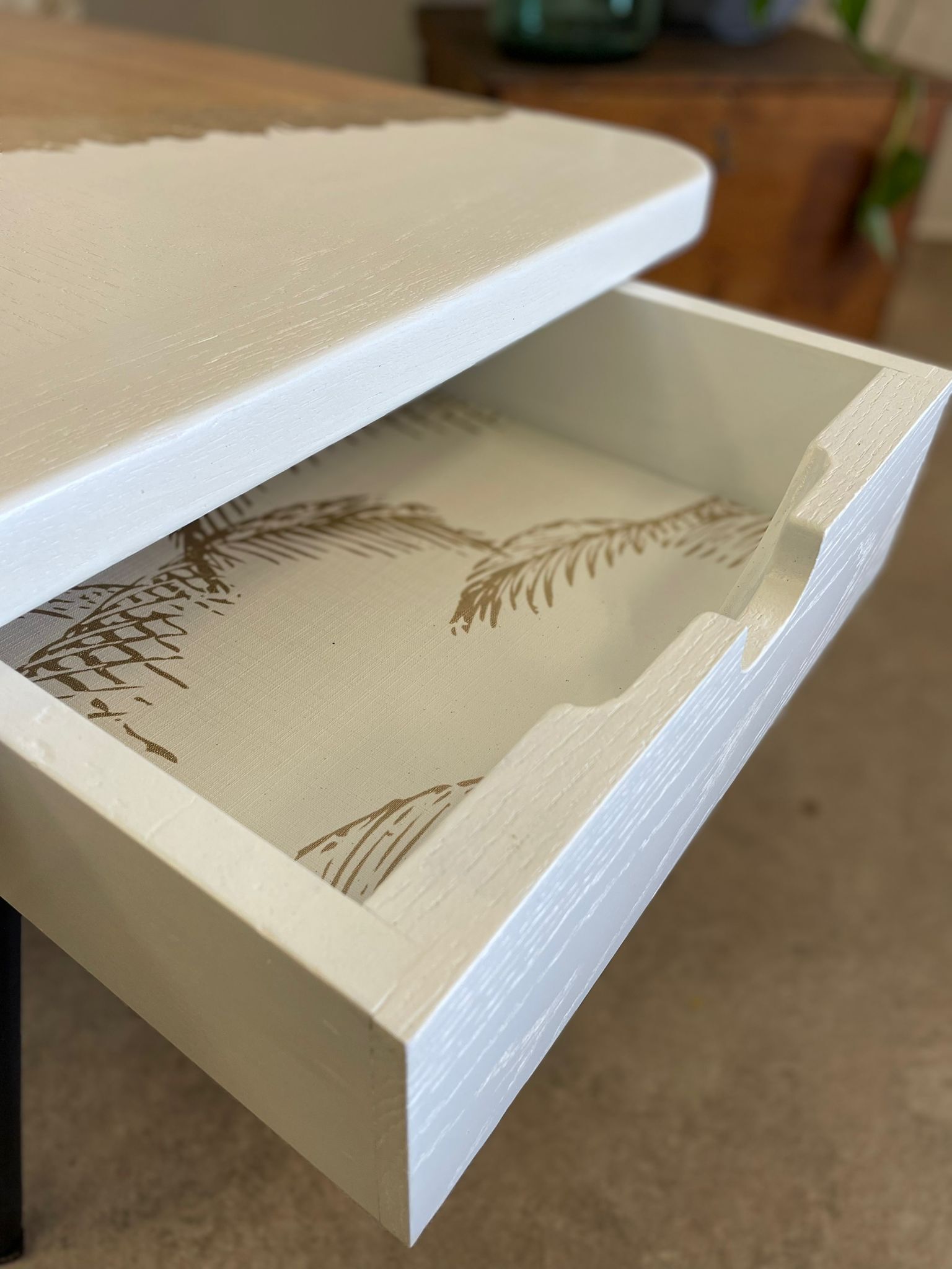 Coffee table with pin legs and gold leaf