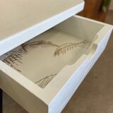 Coffee table with pin legs and gold leaf