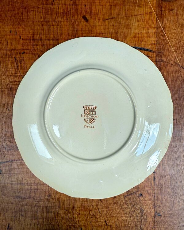 Série de 12 assiettes à dessert Longchamp, décor Mistral