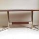 Vintage coffee table from the 1950s in mahogany and metal, with a tabletop width of 110 cm.