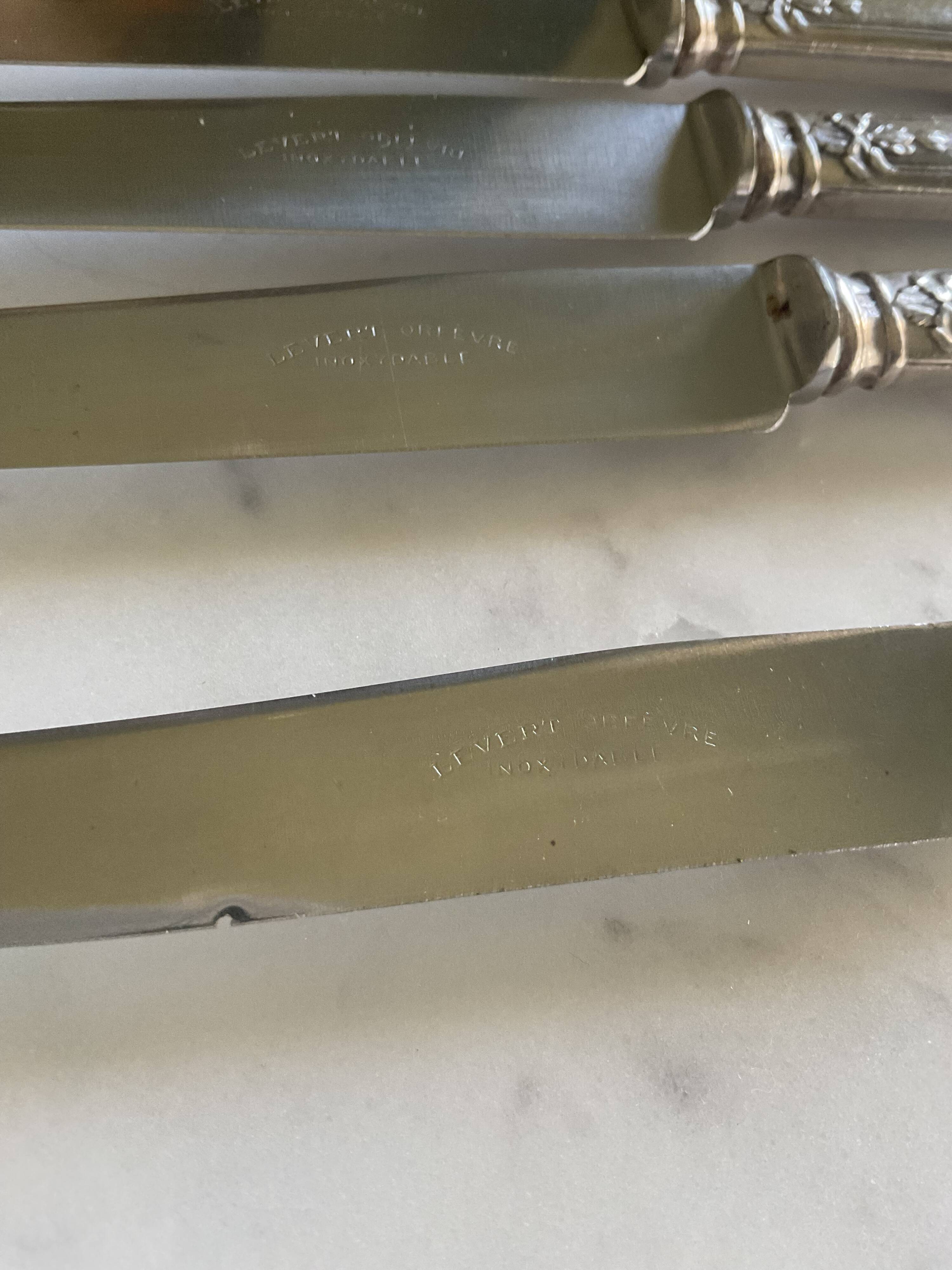 12 silver-plated metal knives. levert silversmith