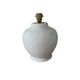 Vintage ceramic lamp with glazed scale patterns.