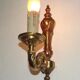 Simple wall sconce in classic Empire style in vintage French bronze.