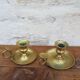 Old pair of brass candlesticks cellar rats