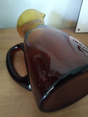Vintage pitcher in amber glass