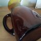 Vintage pitcher in amber glass