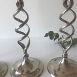 Four twisted silver candlesticks